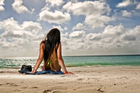 girl looking at a tropical paradiseの写真素材