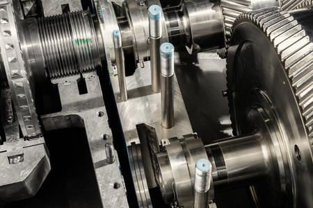 A part of a small steam turbine. Metal gears. Gear wheels of the engine.の写真素材