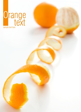 Spiral orange peel reflecting on white background の写真素材