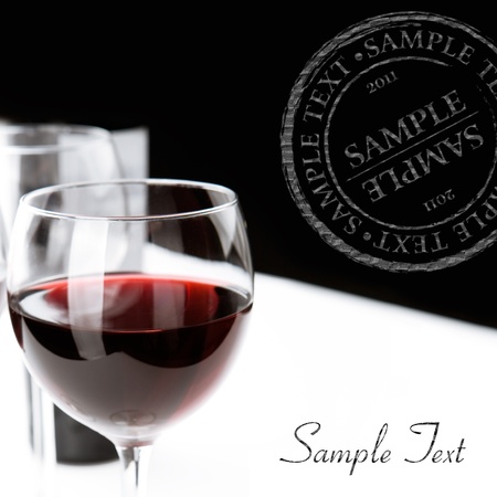 Glasses of red wine on white table cloth  Space for textの写真素材
