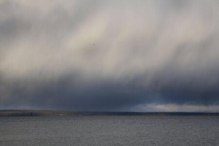 rainy cloud above a lake