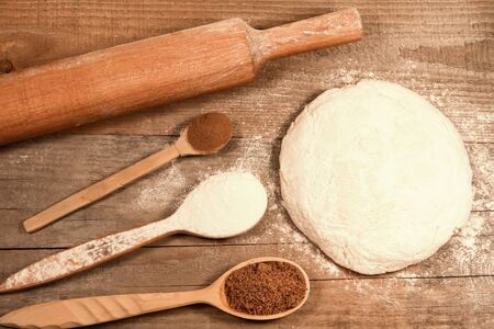 homemade baking. Fresh dough for pastry, kitchen rolling pin, spoon flour on a chopping old Board