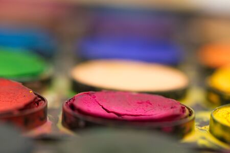 Closeup of messy, used art water-color paint-boxの写真素材