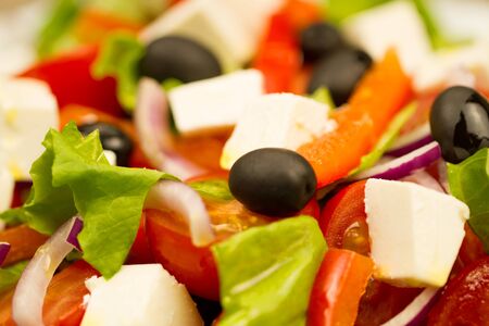 summer Greek salad with olives and feta cheese, closeupの写真素材