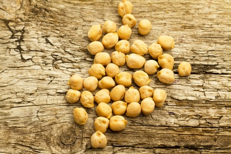 bunch of chickpeas on the old wooden background. Indian cuisineの写真素材