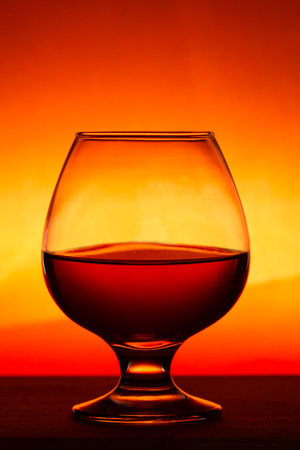 Whiskey or brandy on a wooden tableの写真素材