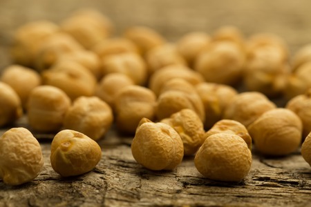 bunch of chickpeas on the old wooden background. Indian cuisineの写真素材