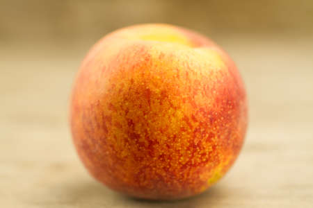 ripe fresh peaches on wooden backgroundの写真素材