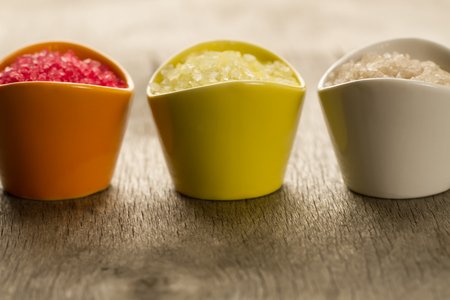 Colorful sea bath salts on wooden backgroundの写真素材