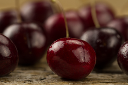 fresh ripe cherry on wooden backgroundの写真素材