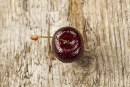 fresh ripe cherry on wooden background