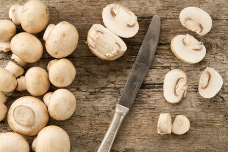 fresh mushrooms on wooden background, close-up