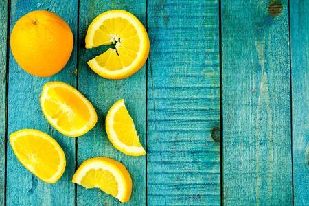 Ripe orange fruit on wooden vintage background. Healthy vegetarian food. Recipe, menu, mock up, cooking.の写真素材