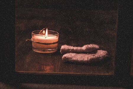 Winter window. Cozy room. Candlesticks on a windowsill.の写真素材