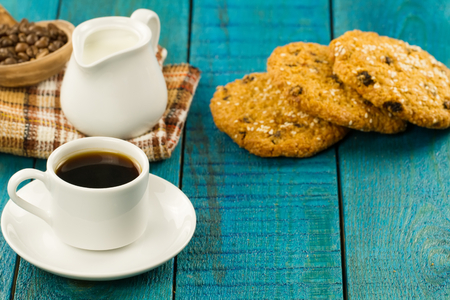 Chocolate chip cookies on an old vintage turquoise wooden background.の写真素材