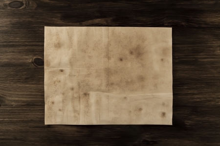 sheet old vintage paper on the aged wooden background. Parchmentの写真素材