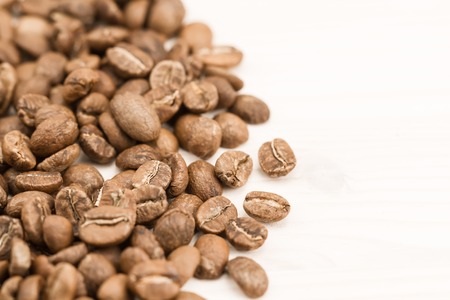 Background coffee. Roasted beans on old wooden backgroundの写真素材