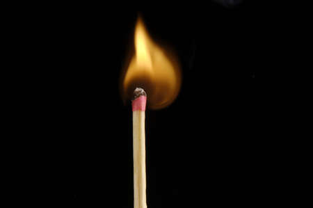 Lit Match Stick on black backgroundの写真素材