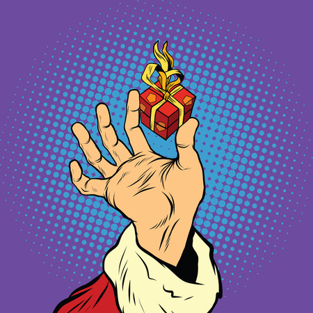 Hand of Santa Claus and a small gift, pop art retro vector illustration. Holidays New year and Christmasのイラスト素材