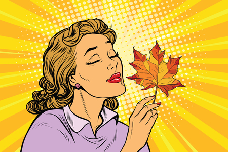 Girl and autumn, a woman with red maple leaf. pop art retro vector illustration. The seasons of natureのイラスト素材