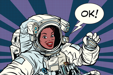 OK gesture woman astronaut in a spacesuit, pop art retro comic book vector illustrationのイラスト素材