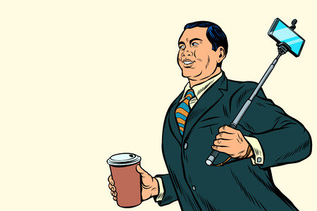Asian businessman with a selfie stick and coffeeの写真素材