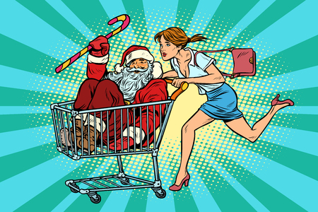 Christmas sale. The woman bought Santa Claus. shopping cart trolの写真素材