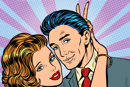 woman puts horns to man, hand gesture joke. Pop art retro vector illustration vintage kitschのイラスト素材