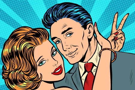 couple in love hugs victory gesture. Pop art retro vector illustration vintage kitschのイラスト素材
