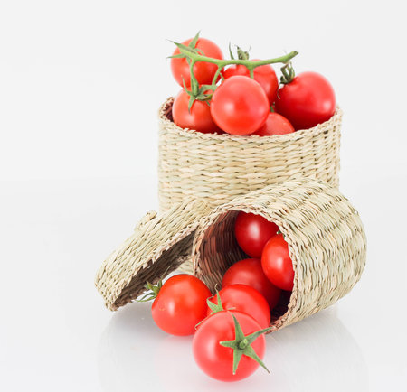 Red tomatoes in wicked boxの写真素材
