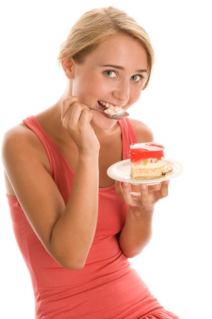 Woman eating cream cakeの写真素材