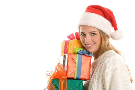 Young woman with Santa cap with pile of giftsの写真素材