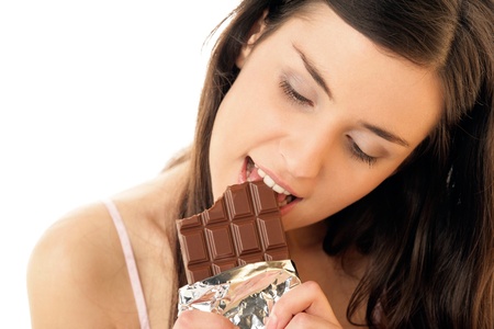 Woman eating chocolateの写真素材