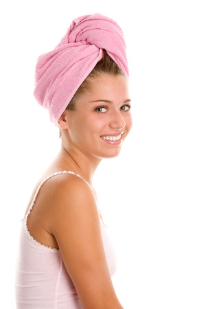 Young woman with hair wrapped in towelの写真素材