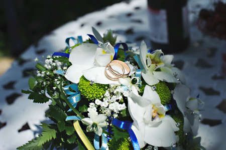 Stylish bride's bouquet. Wedding flower with rings.の写真素材