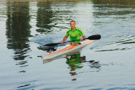 Bendery,Pridnestrove, June 18-19,2015 competition of rowing. Open Championship Pridnestrove rowing. Sportsmen in sport kayaks paddles on the water.のeditorial素材
