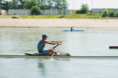 Bendery,Pridnestrove, June 18-19,2015 competition of rowing. Open Championship Pridnestrove rowing. Sportsmen in sport kayaks paddles on the water.のeditorial素材
