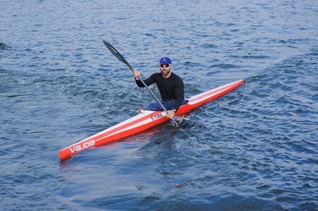 Kherson,Ukraine, September 30,2014 competition of rowing. Michael Pirkl in sport kayak paddles on the water. More than 100 participants took part in the competitions.のeditorial素材