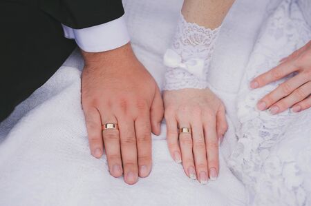 Bride and groom's hands with wedding rings. Gorizontal.