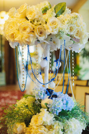 Floral wedding decoration with beads on the rack indoor. Verticalの写真素材