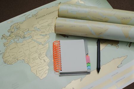 Modern notebook, map, pen on texture background.Space for text. Travel and holiday concept.