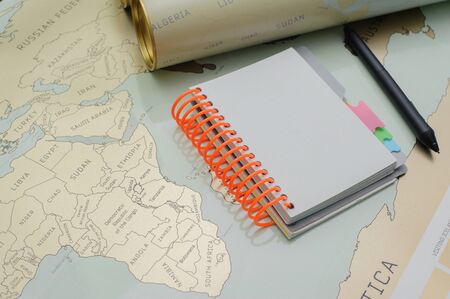 Modern notebook, map, pen on texture background.Space for text. Travel and holiday concept.の写真素材