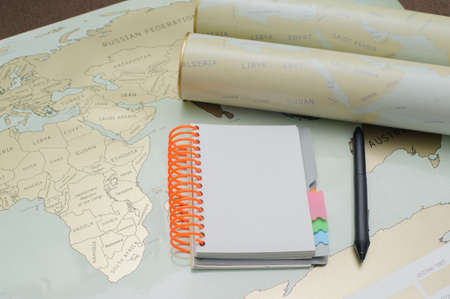 Modern notebook, map, pen on texture background.Space for text. Travel and holiday concept.の写真素材