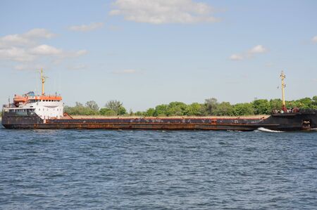 Old bulk carrier on river. Logistic conceptの写真素材