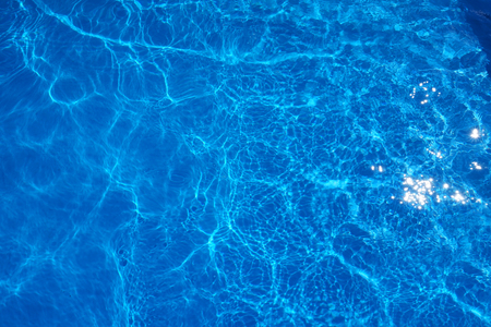 The reflections of the Sun in the swimming poolの写真素材