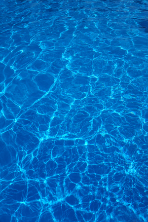 The reflections of the Sun in the swimming poolの写真素材