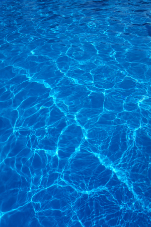 The reflections of the Sun in the swimming poolの写真素材