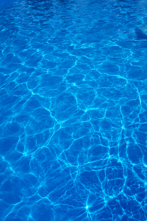 The reflections of the Sun in the swimming poolの写真素材