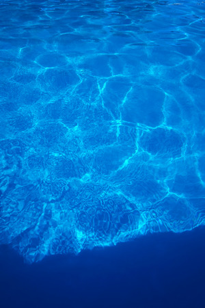 The reflections of the Sun in the swimming poolの写真素材