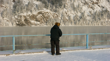 winter fishing on a fishing rodの写真素材
